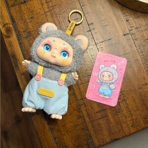 Kimmon collectible Gray and Blue Plush Bag Charm with Character Design